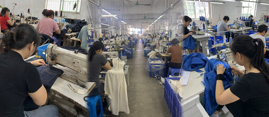 A garment factory sewing line: two rows of machinists working on denim and blue fabric under daylight windows.
