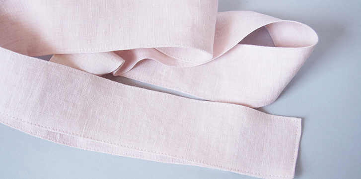 Trench component reference: a finished fabric belt with stitched edges