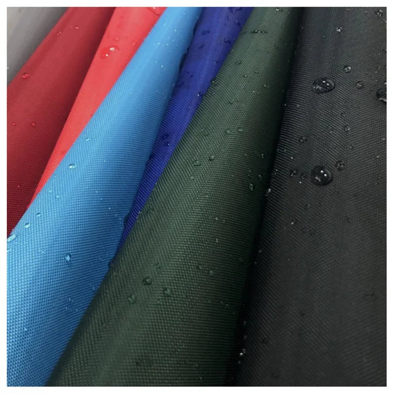 Several coated 420D Oxford fabric rolls, illustrating a technical Oxford sold by denier and finished construction.