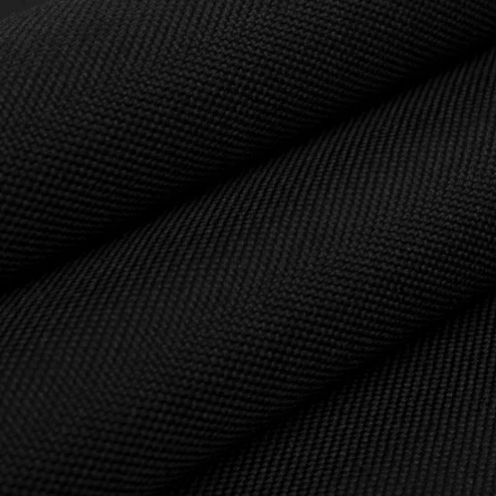 Black 600D Oxford fabric folded in close-up, showing the dense woven technical surface without branding.