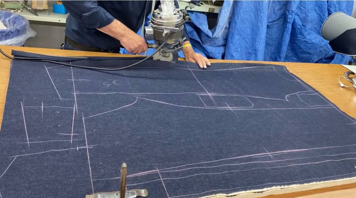Denim pattern pieces laid out for cutting