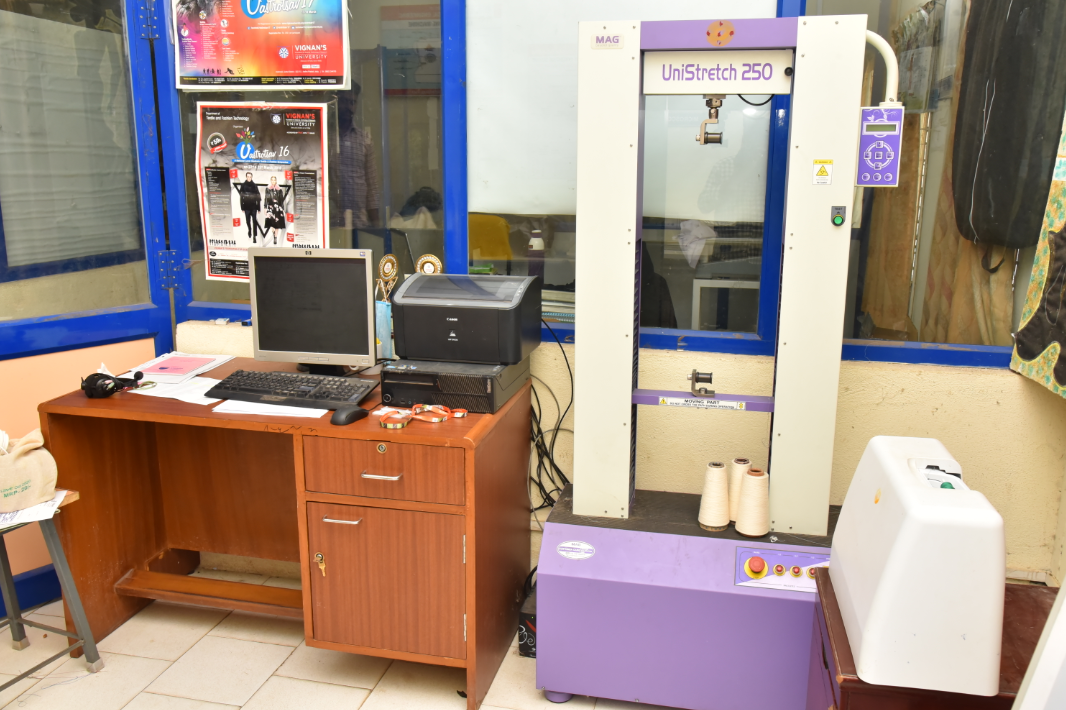 Textile tensile and stretch testing machine in a laboratory.