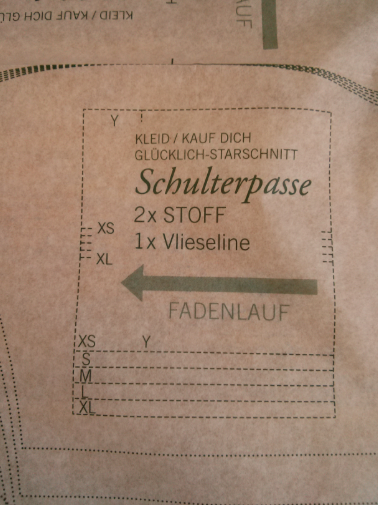 Close-up view of a sewing-pattern sheet with printed pattern lines and construction marks