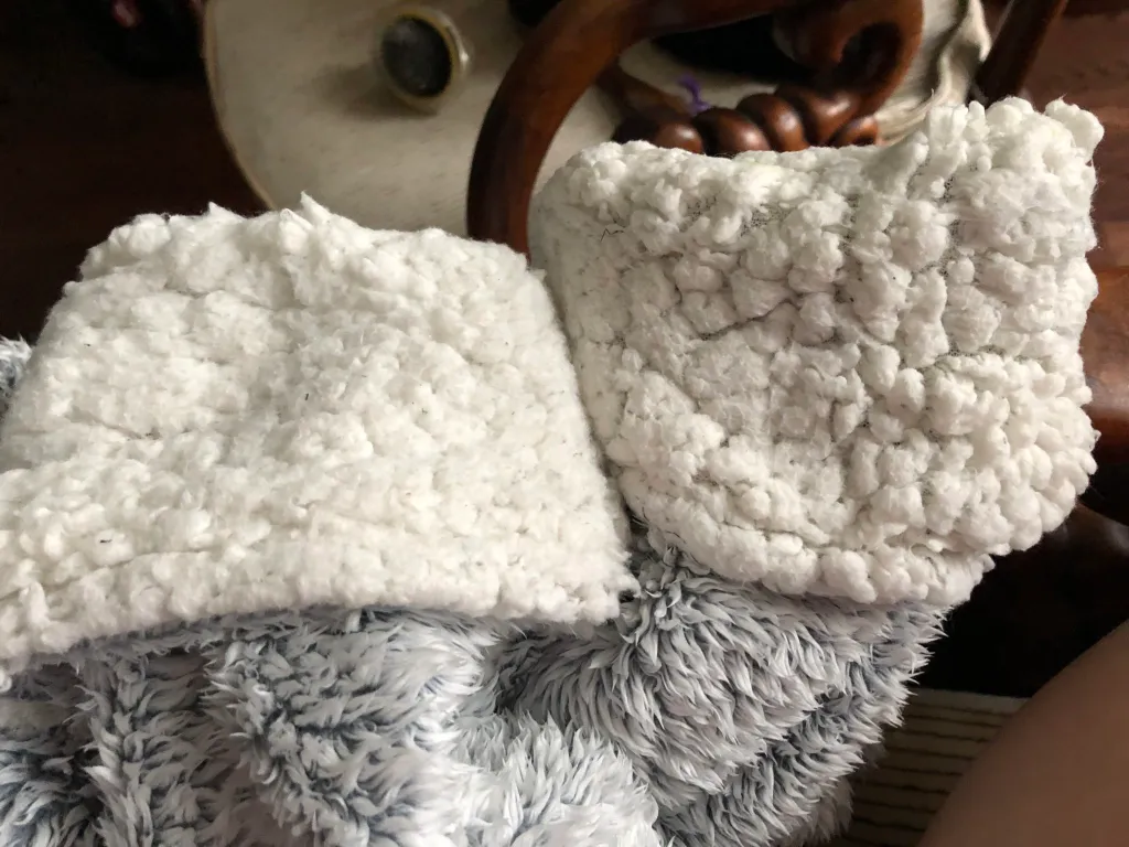 Before-and-after comparison of faux sherpa pile at a cuff after repeated washing and refluffing.