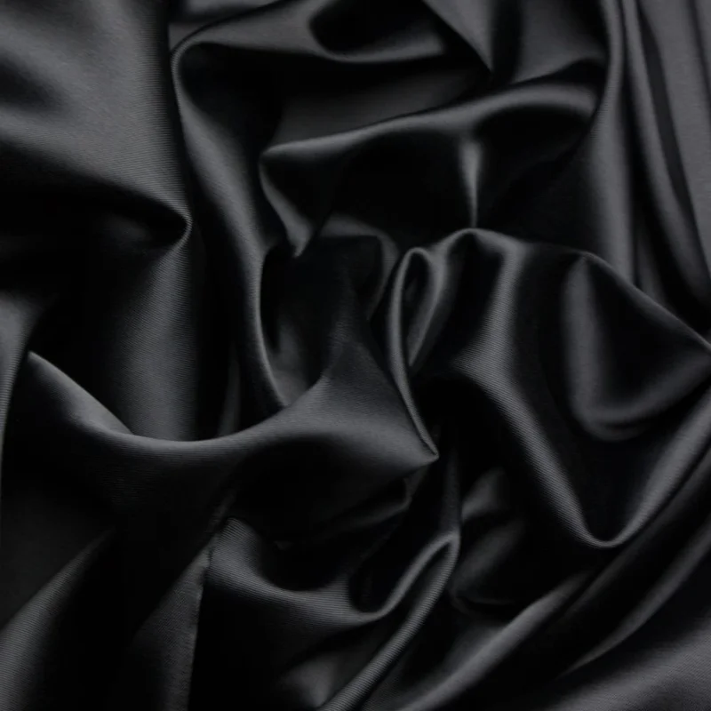 Black satin with bright highlights and deep shadows