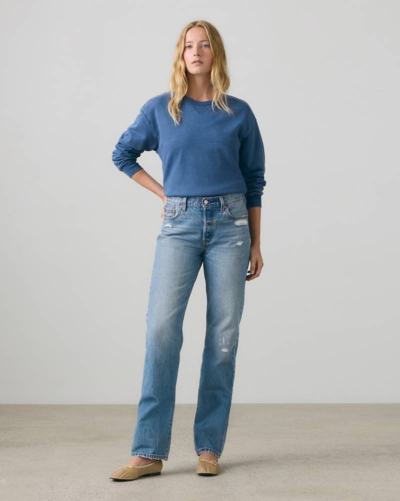 Blue straight jeans with an even lower leg and full-length hems