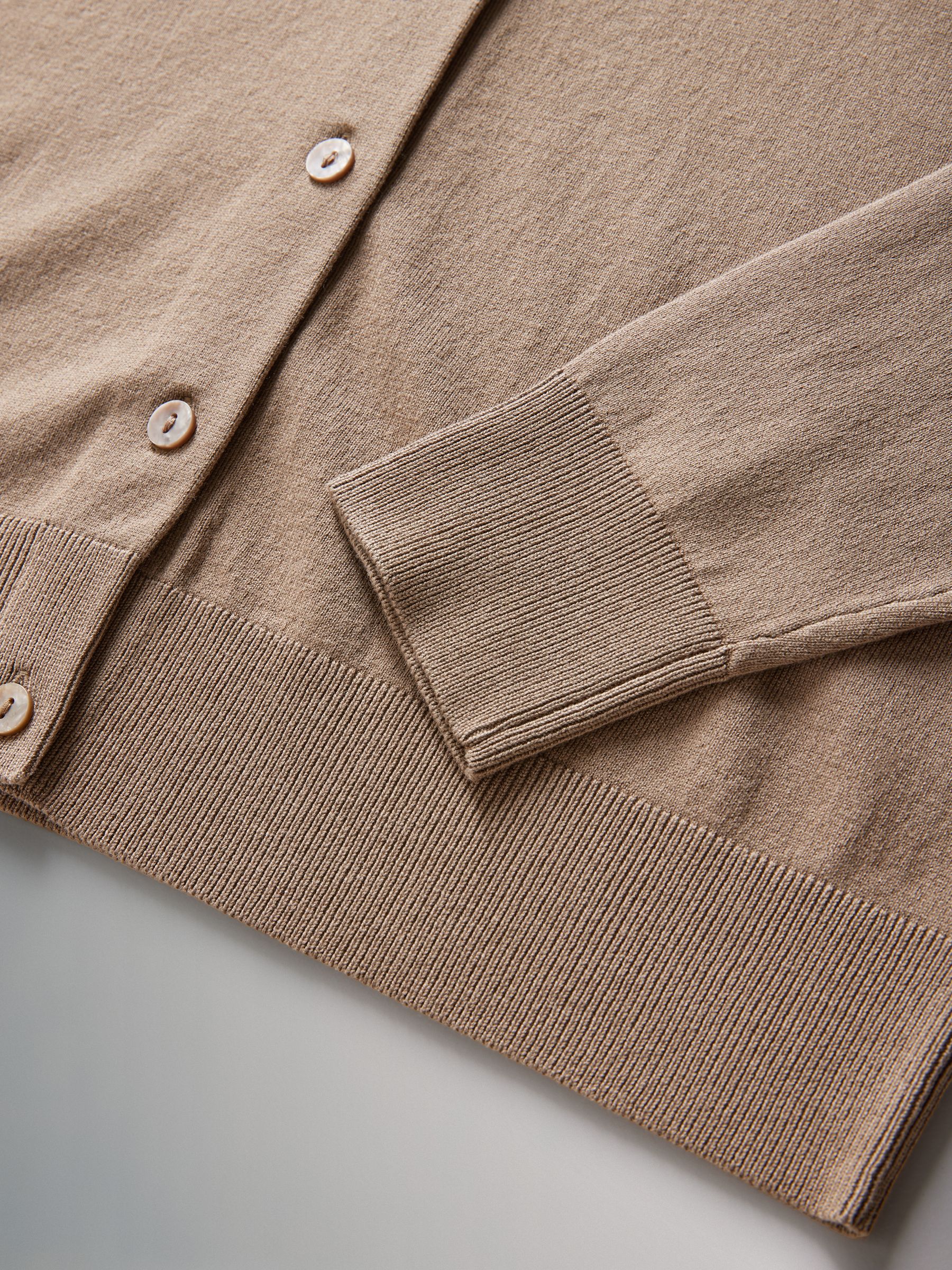 Cardigan ribbed cuff and lower hem detail