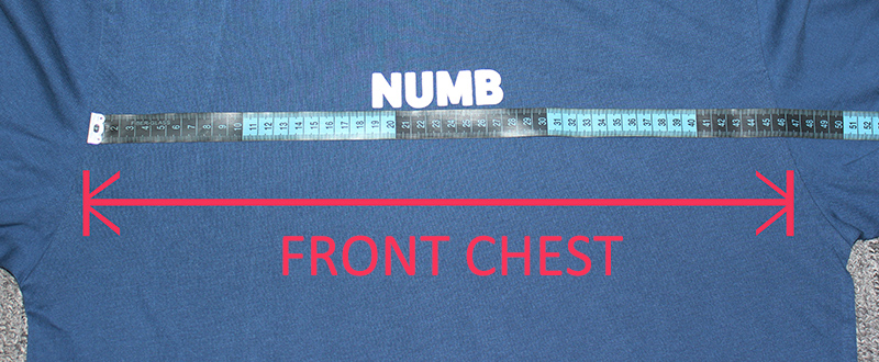 A measuring tape laid across the chest of a flat T-shirt.