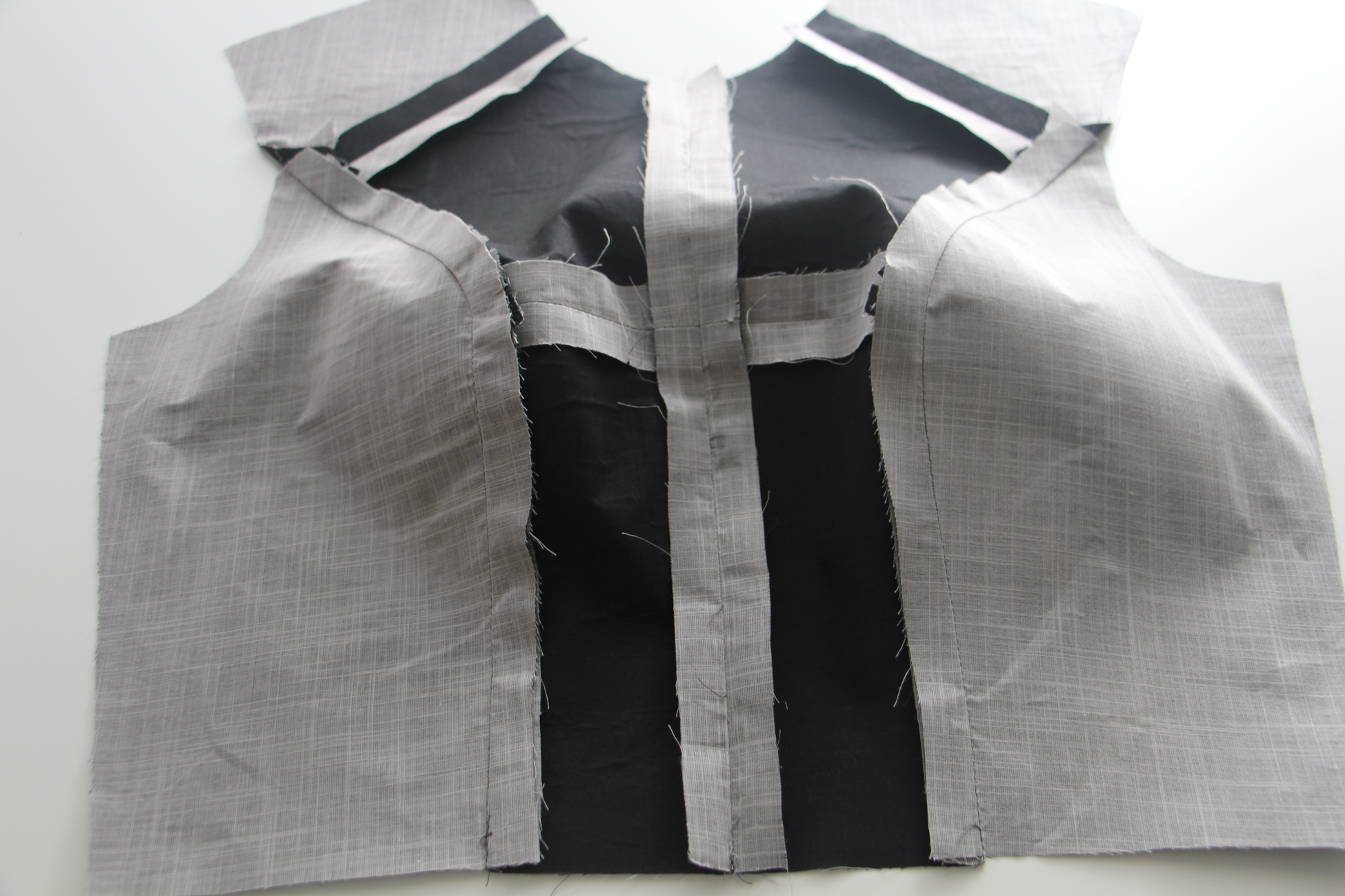 Construction reference: shaped dress bodice panels with curved princess seams and pressed seam allowances