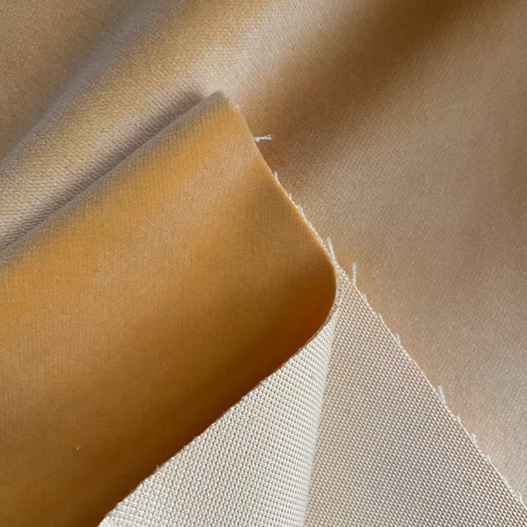 Cut velvet folded to expose the plush face and the woven backing underneath.