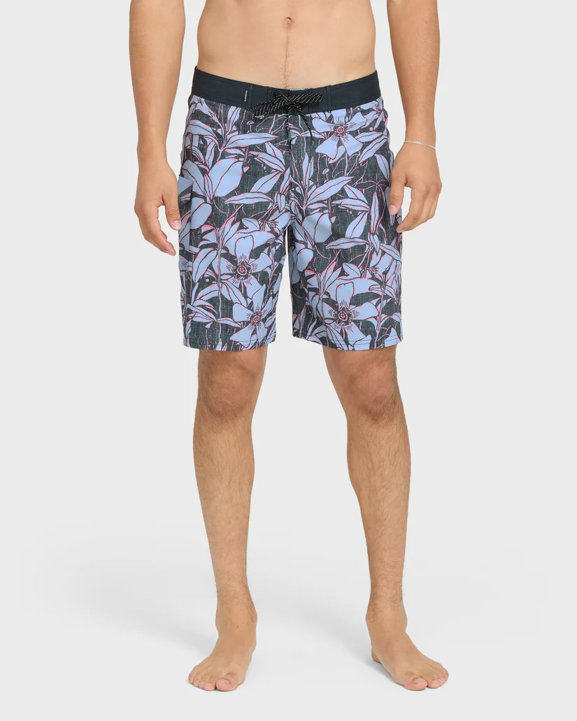 Dark printed surf boardshorts with a flat waist and longer straight legs