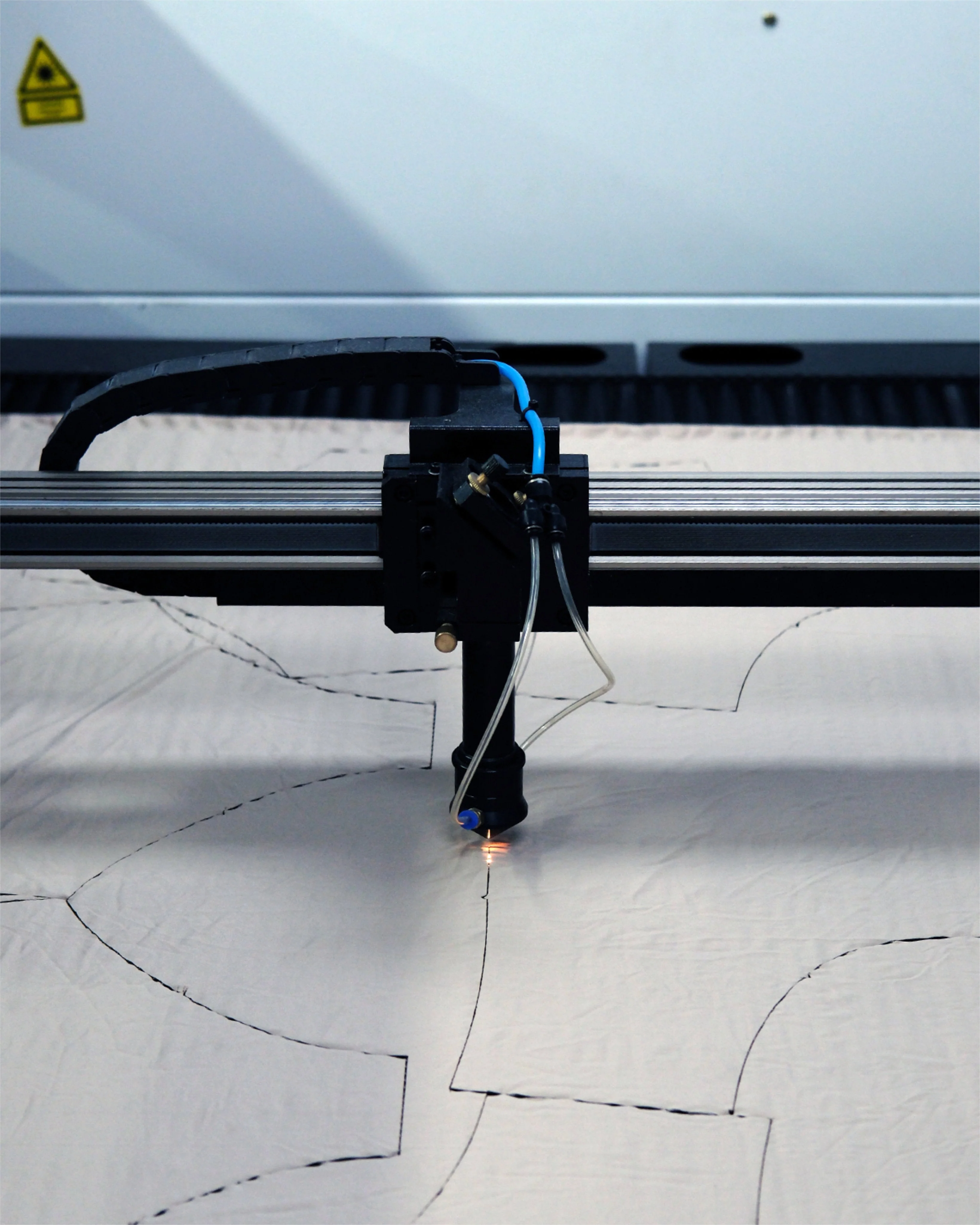 External production reference: automated cutting of swimwear pattern pieces