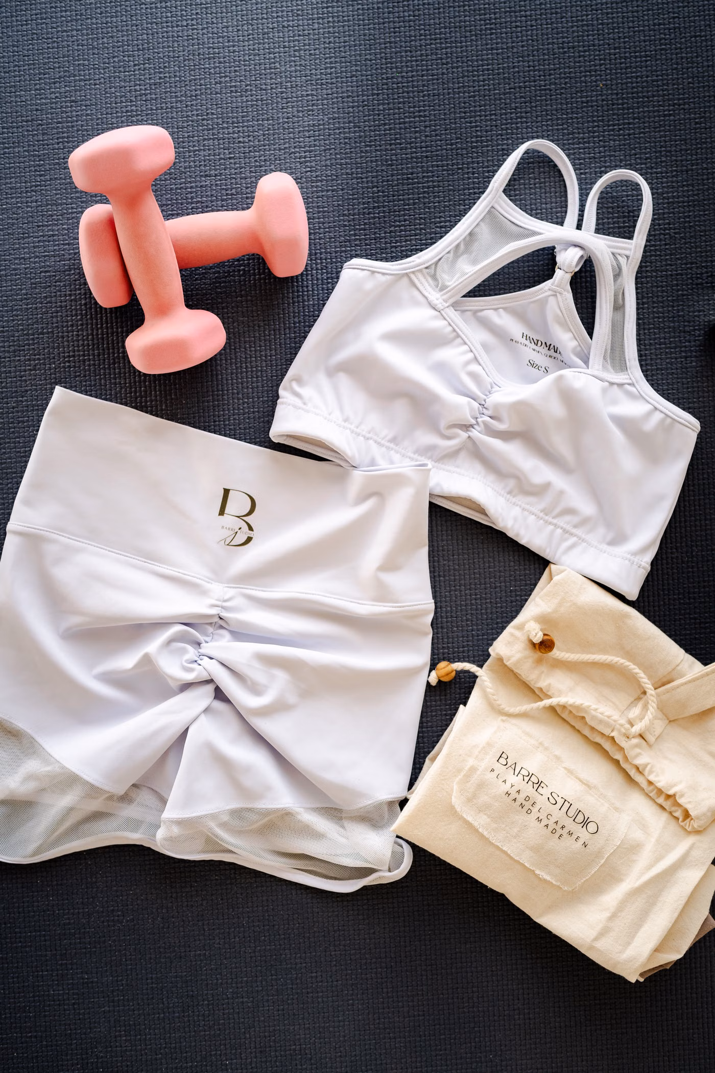 Flat lay of sports bra, shorts, leggings and workout gear