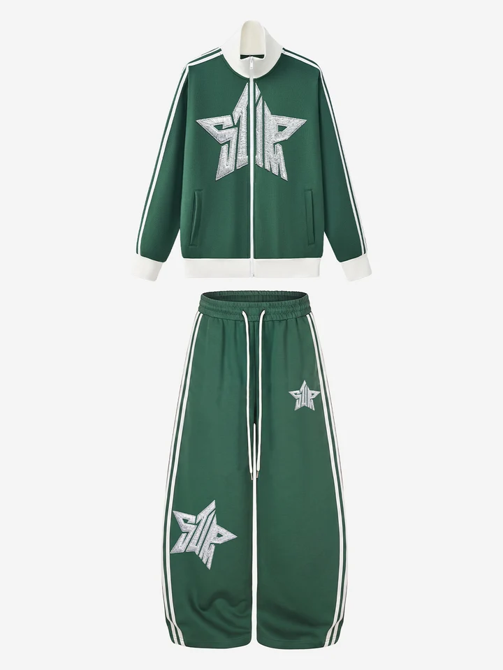 Green track jacket and matching trousers arranged together, with cream stripes and star graphics.
