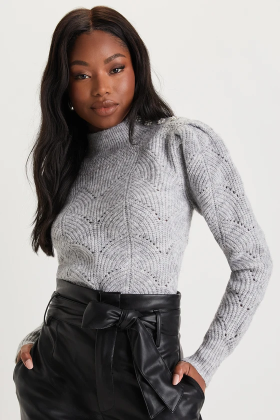 Grey mock-neck sweater with a short standing collar.