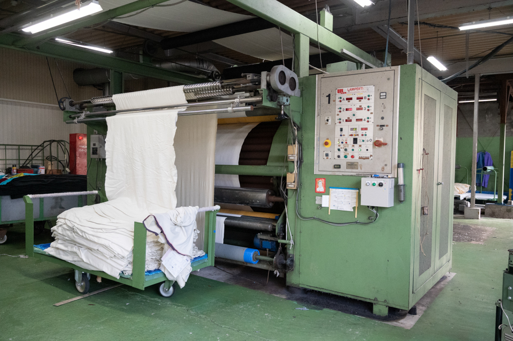 Industrial textile napping machine used to raise fibers from a fabric surface during finishing.