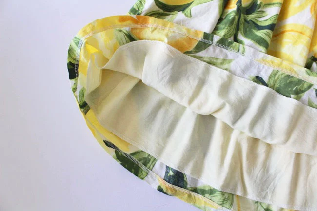 Inside a gathered skirt showing the separate pale lining attached beneath the waistband