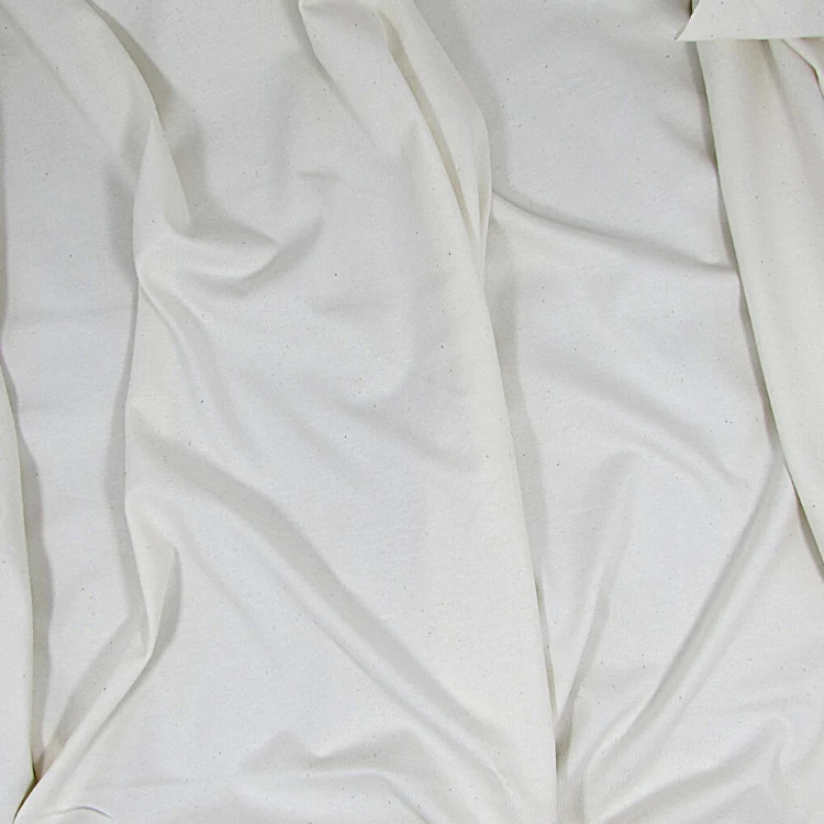 Natural cotton jersey fabric showing its knitted surface and soft folds