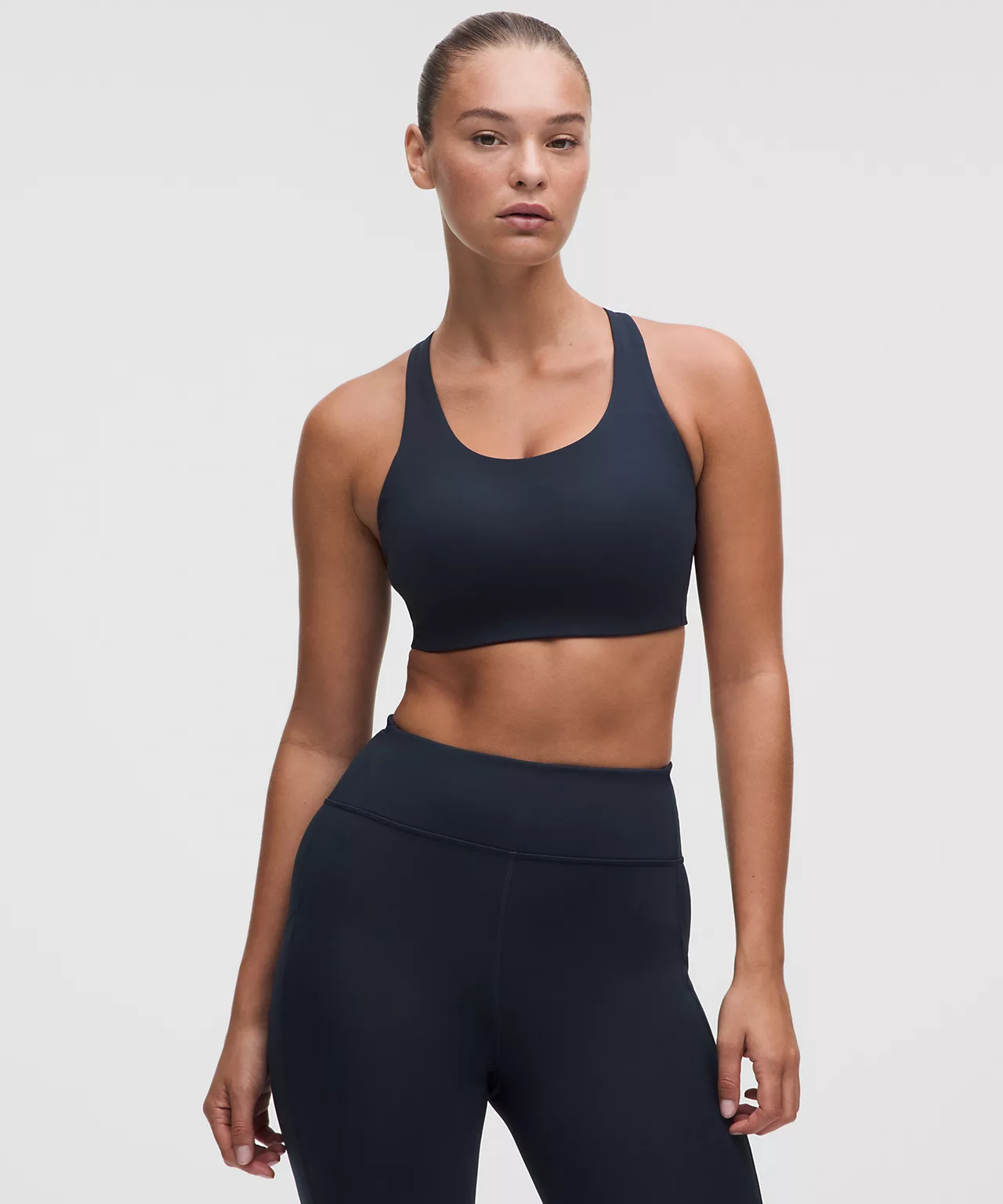 Navy sports bra with a broad underband.
