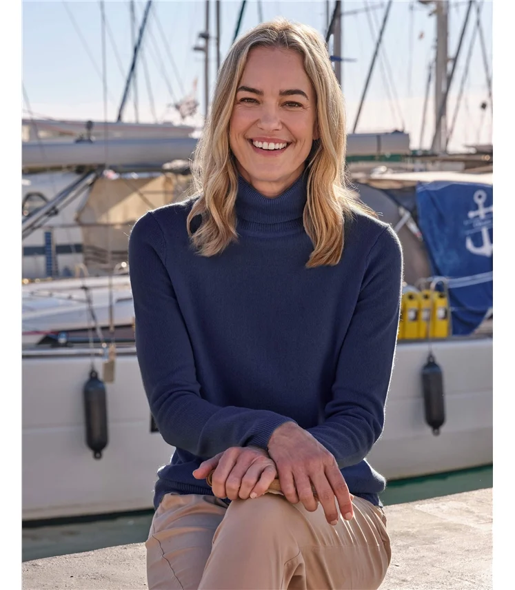 Navy turtleneck with a folded collar.