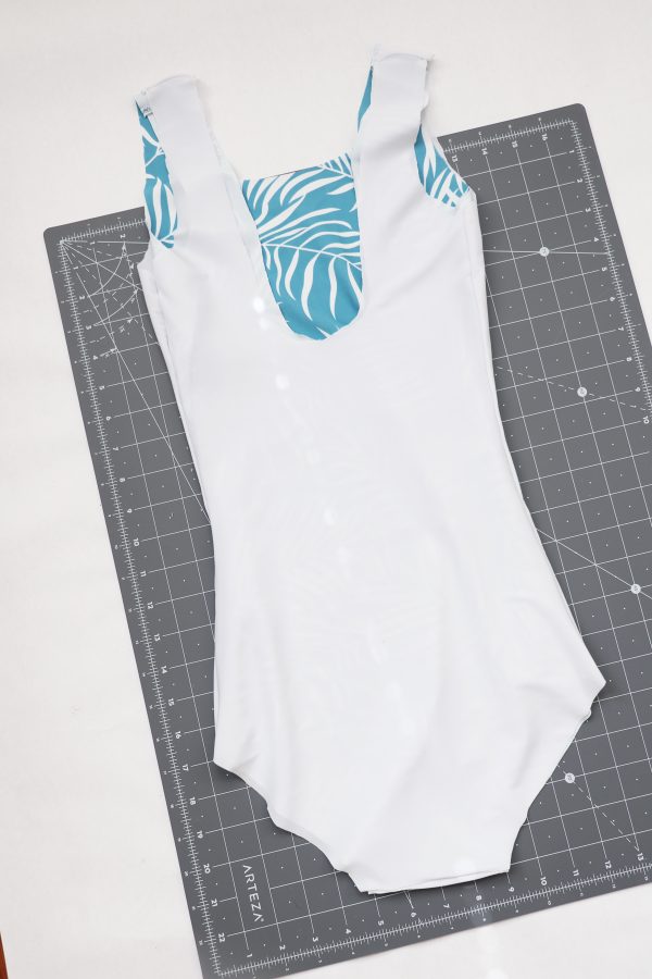 One-piece swimsuit shown inside out with lining and finished body construction