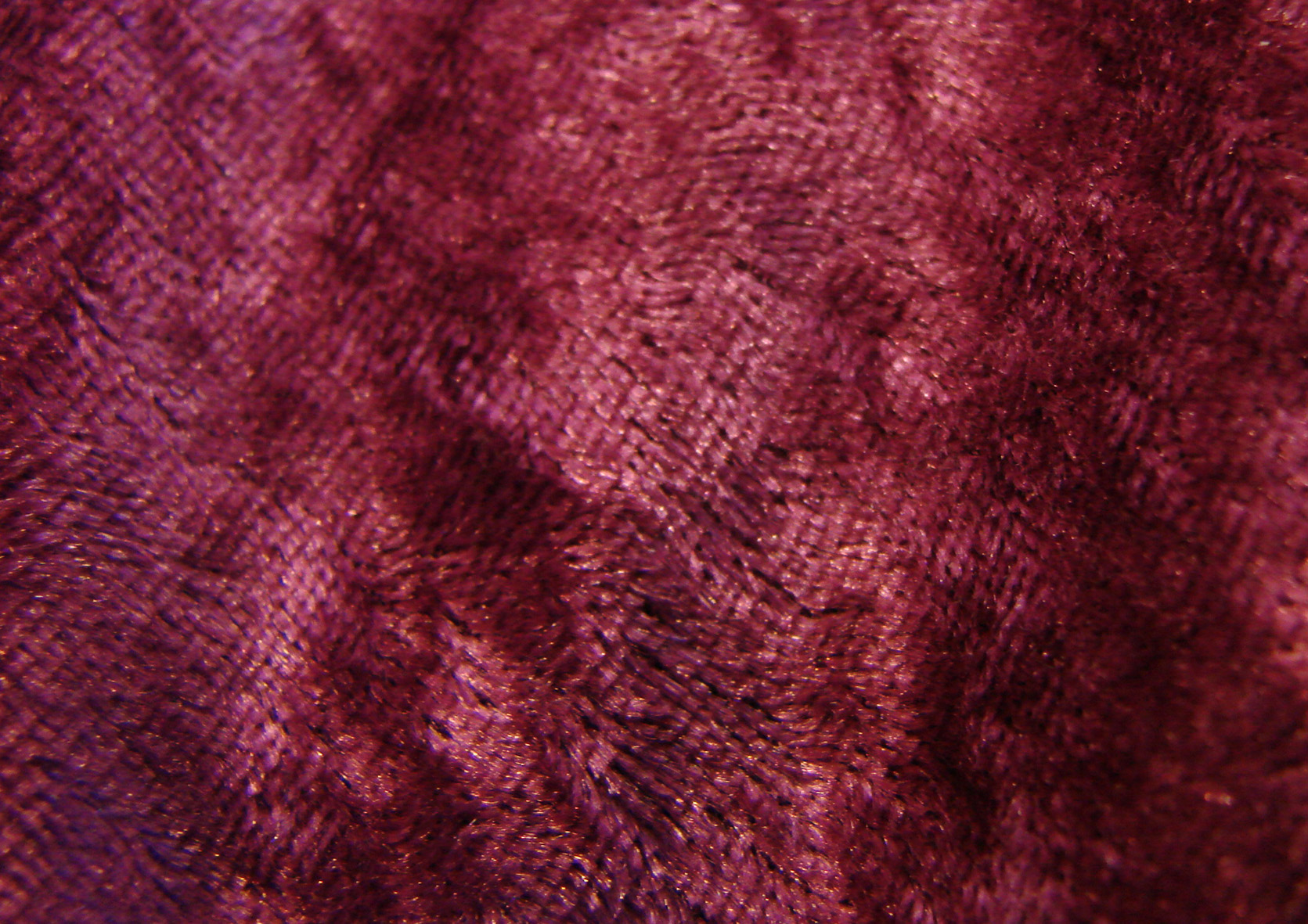 Purple velour fabric with a plush pile surface.
