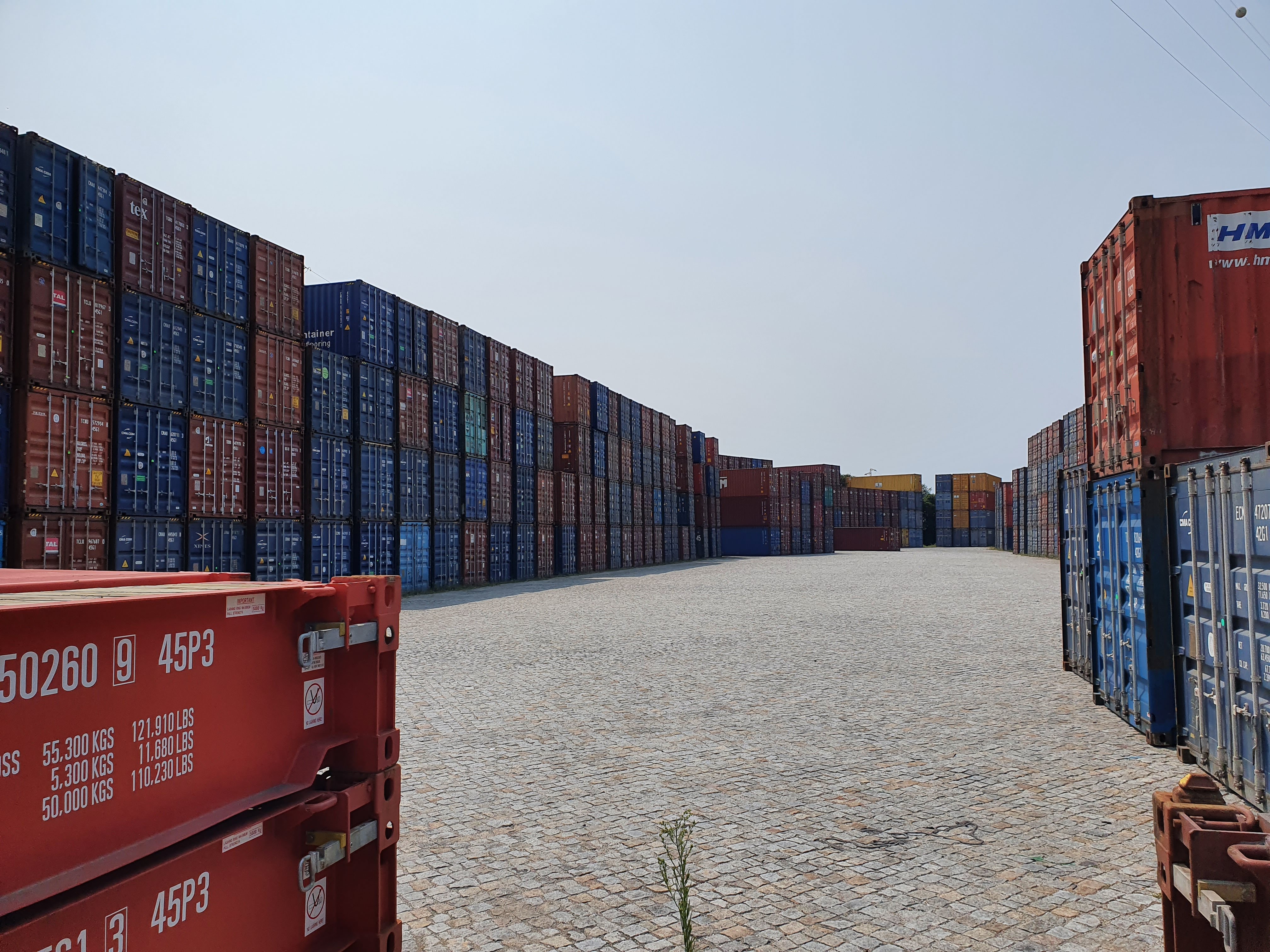 Rows of empty intermodal shipping containers stacked at a depot near the Port of Leixoes in Portugal