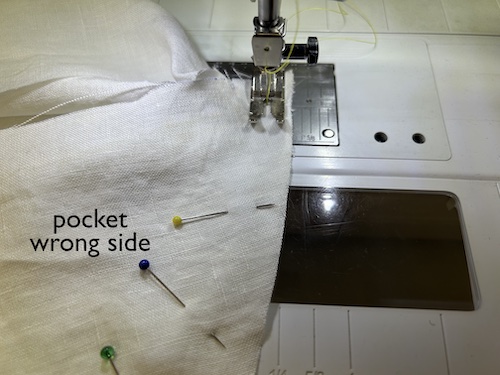 Sewing an in-seam skirt pocket bag at the machine with the opening held in position