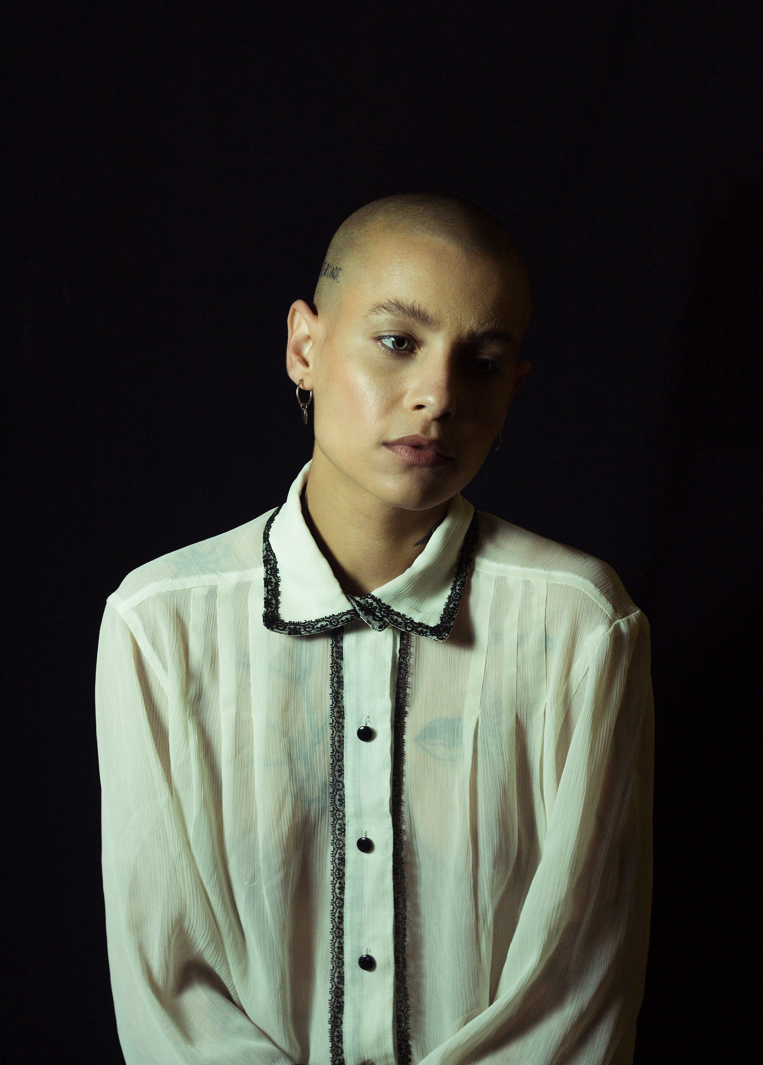 Sheer white collared blouse showing transparent construction
