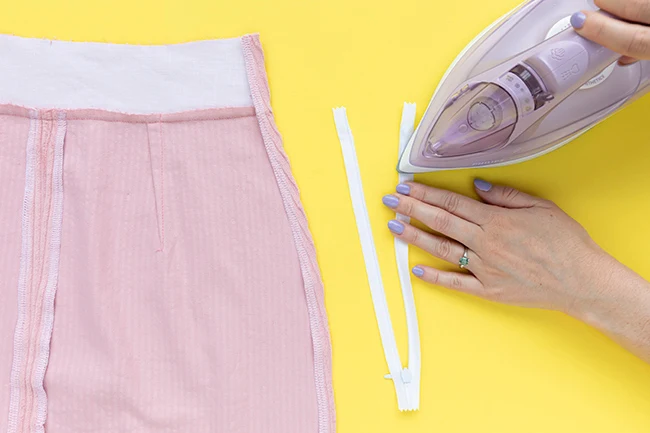 Skirt zipper opening with interfaced waistband, pressed allowances and concealed zipper preparation