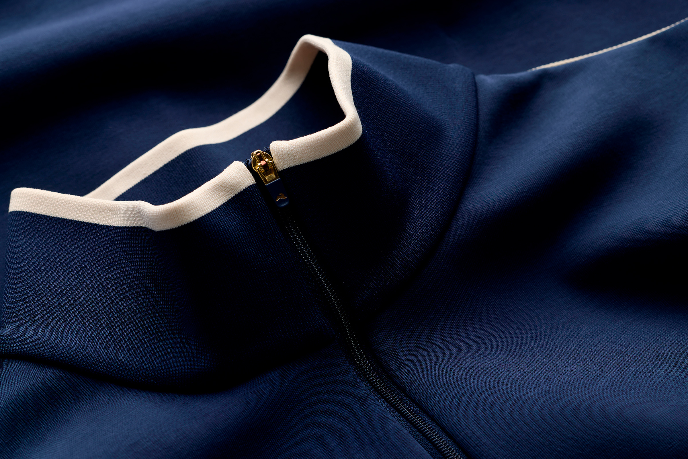 Track jacket center-front zipper and stand-collar detail