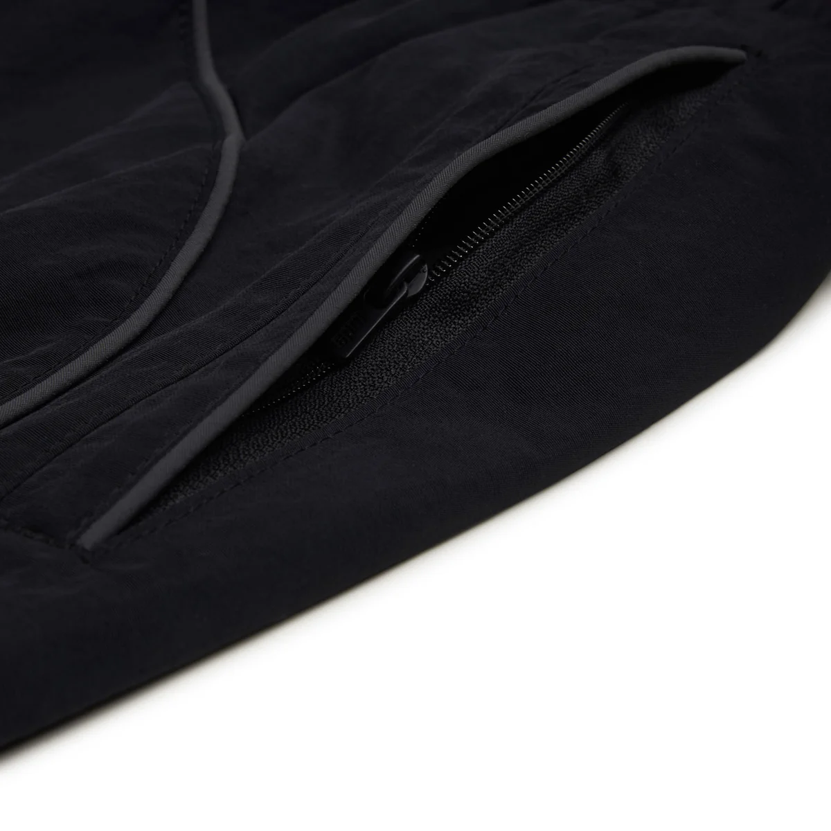 Track pants side zipper pocket and pocket opening detail