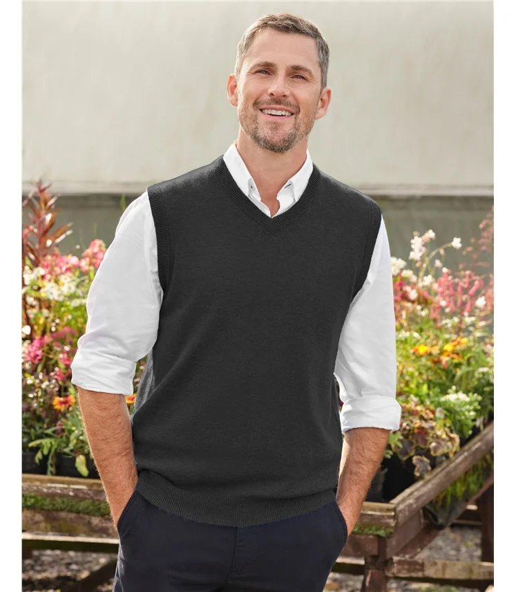 V-neck sweater vest layered over a shirt.