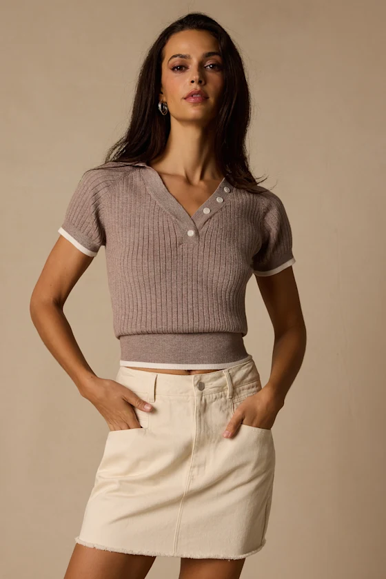 Vertical ribbing on a taupe knitted top.