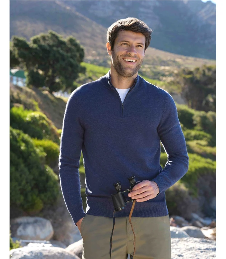 Zip-neck sweater with a partial front opening.
