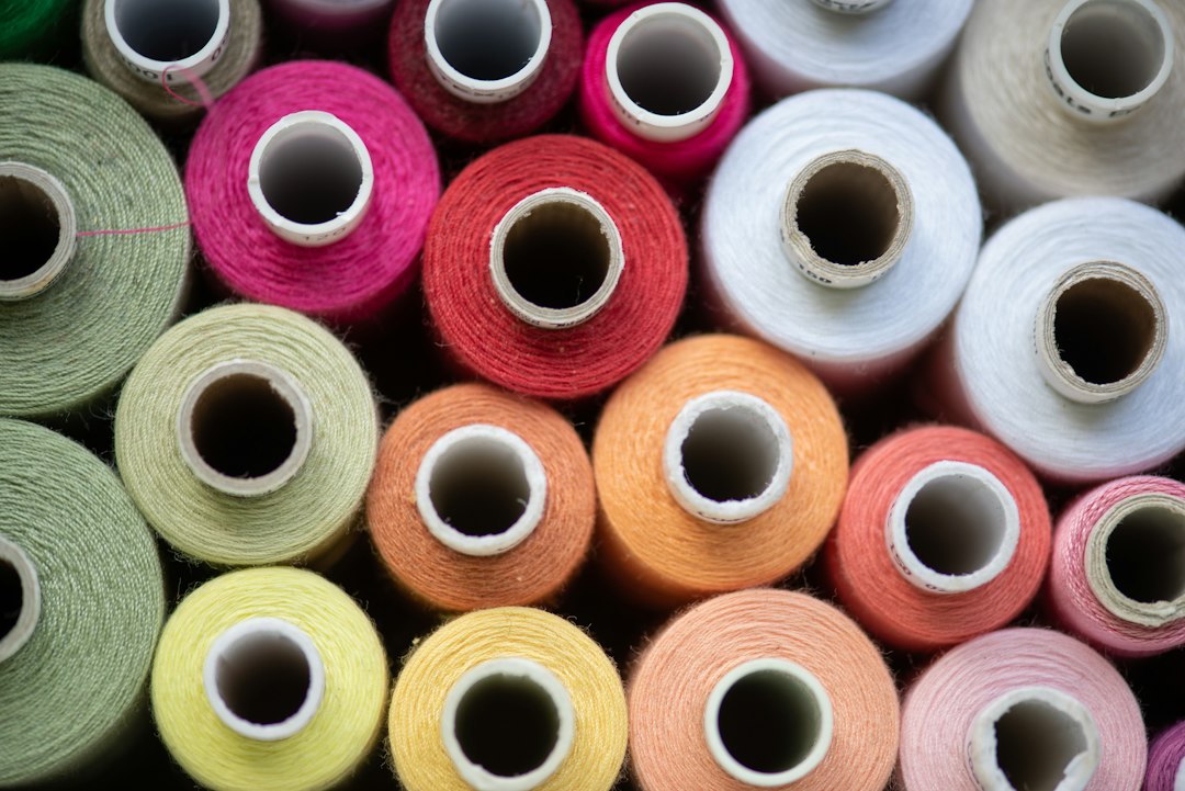 Brightly colored dyed yarn spools