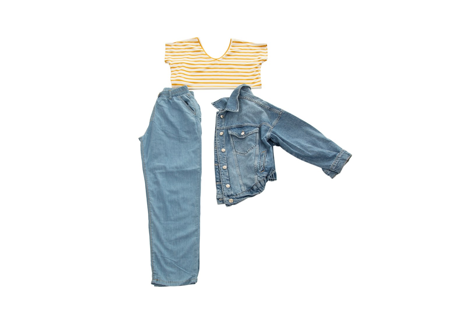 Jacket, T-shirt and trousers laid flat to show the overall silhouette and proportions of a complete outfit