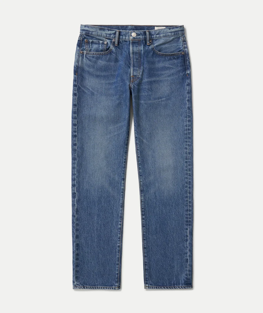 Blue straight-leg jeans laid flat