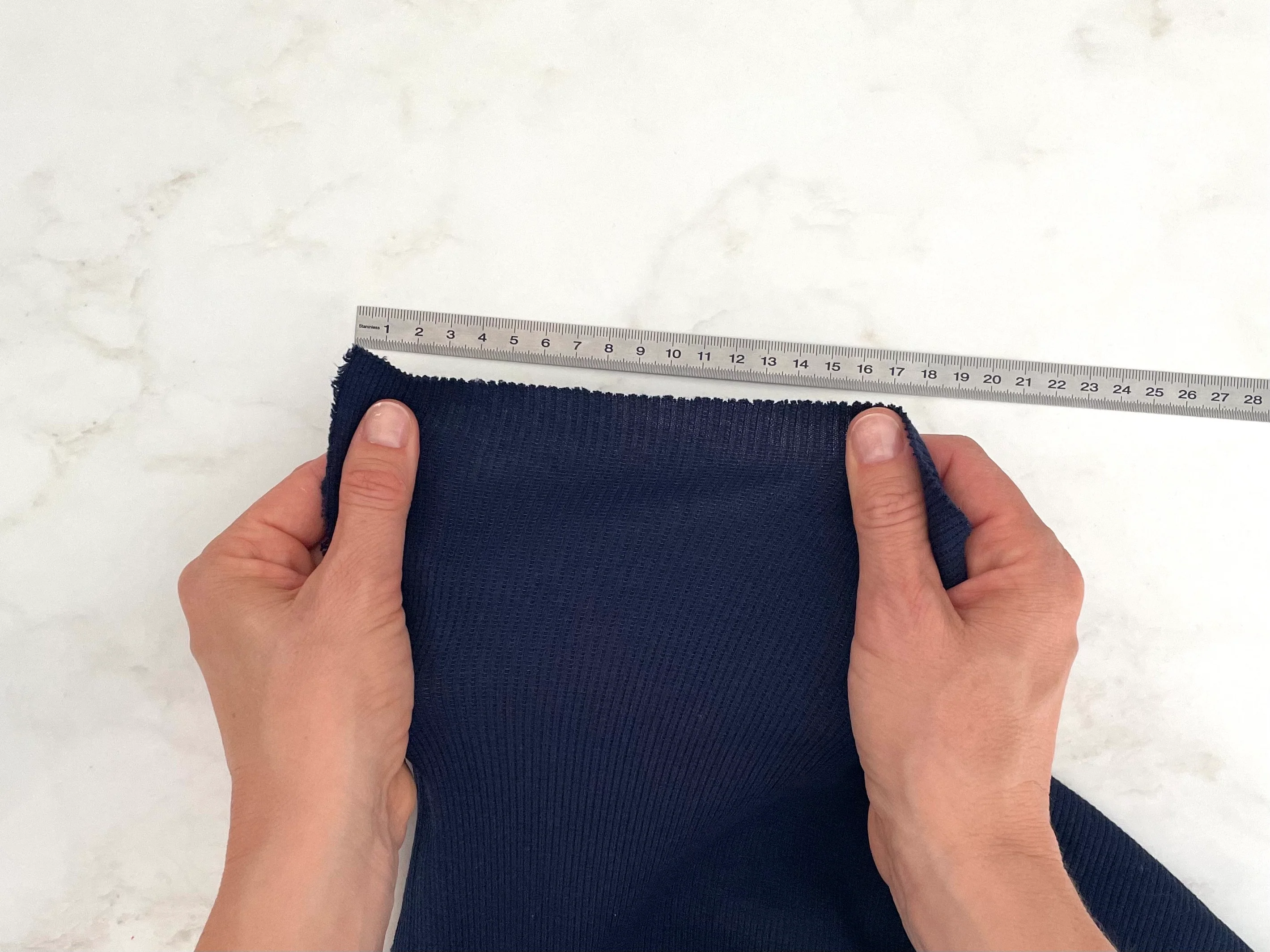 Jersey stretch measured against a ruler